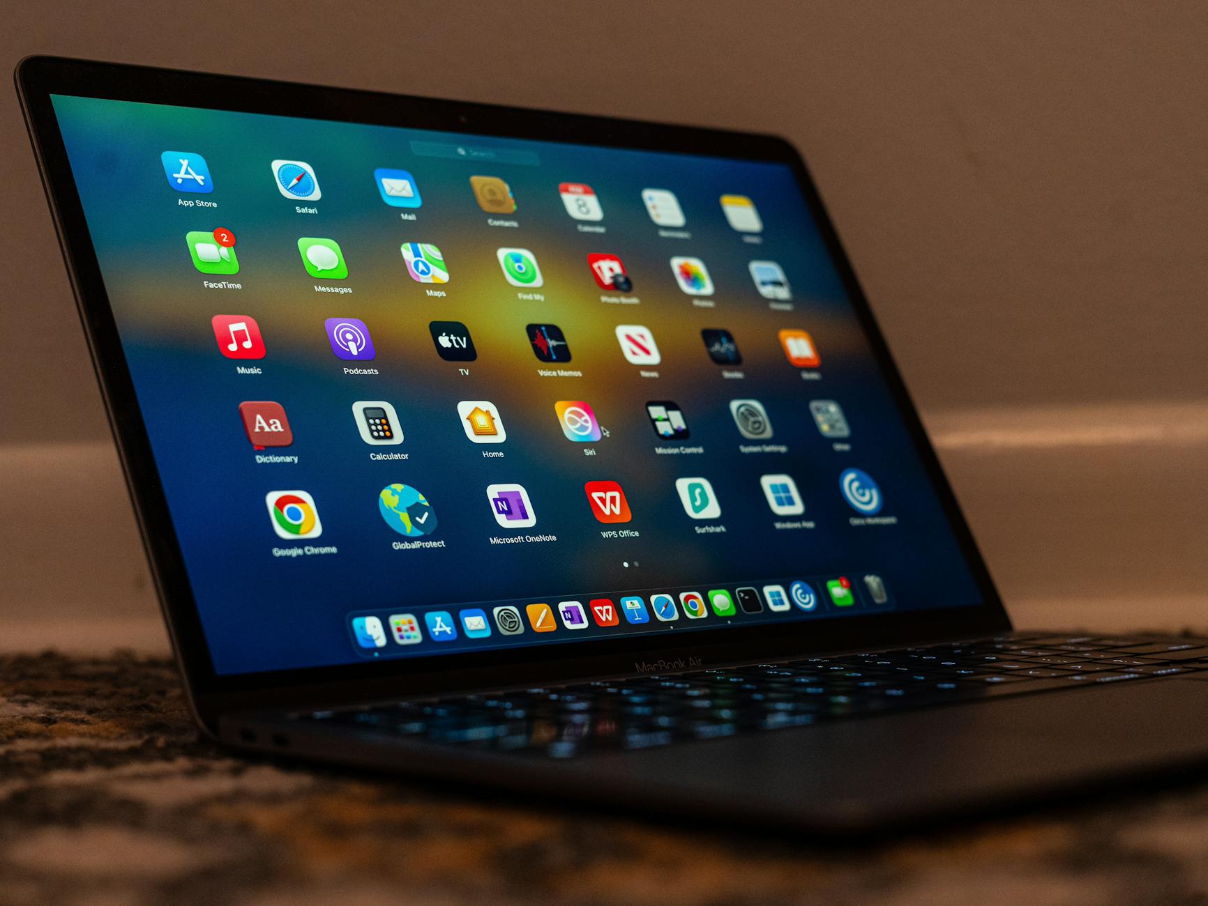 sleek laptop display with various applications